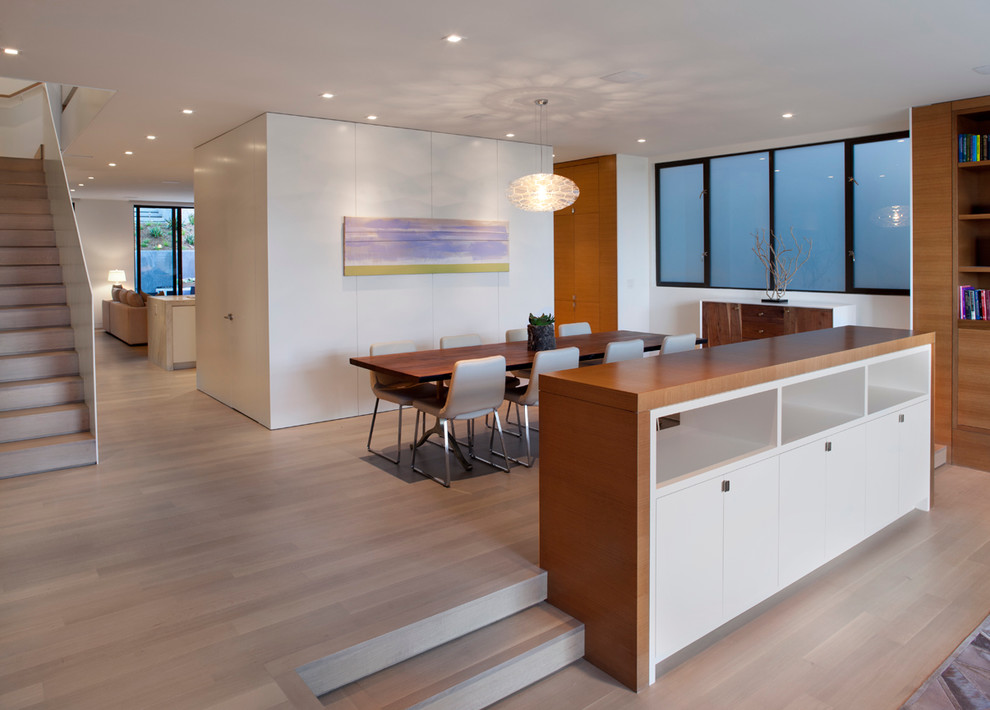 Design ideas for a modern dining room in San Francisco with dark hardwood flooring.