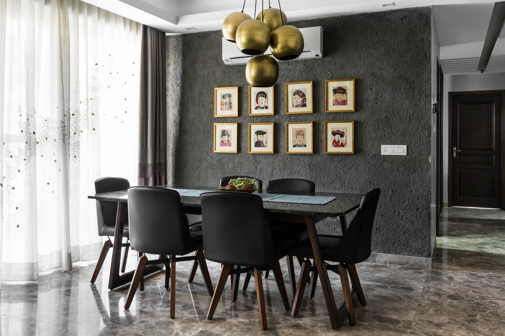 Idée de décoration pour une salle à manger design avec un mur noir et un sol gris.