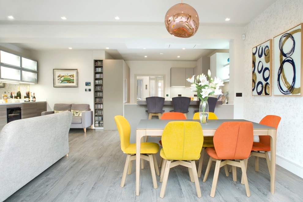 Inspiration for a medium sized contemporary open plan dining room in London with grey floors.