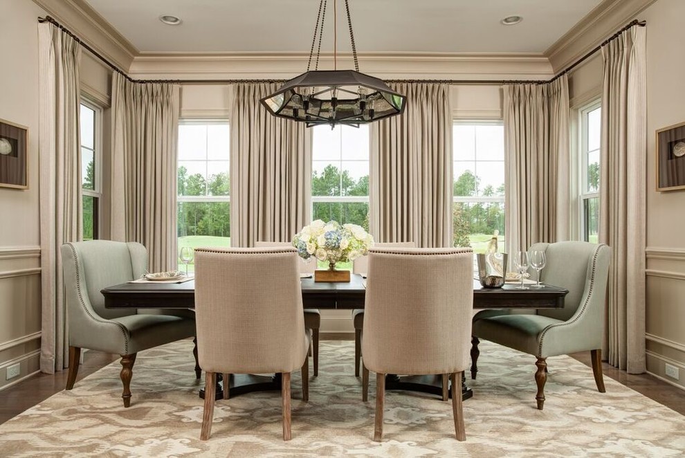 Medium sized classic enclosed dining room in Wilmington with beige walls and medium hardwood flooring.