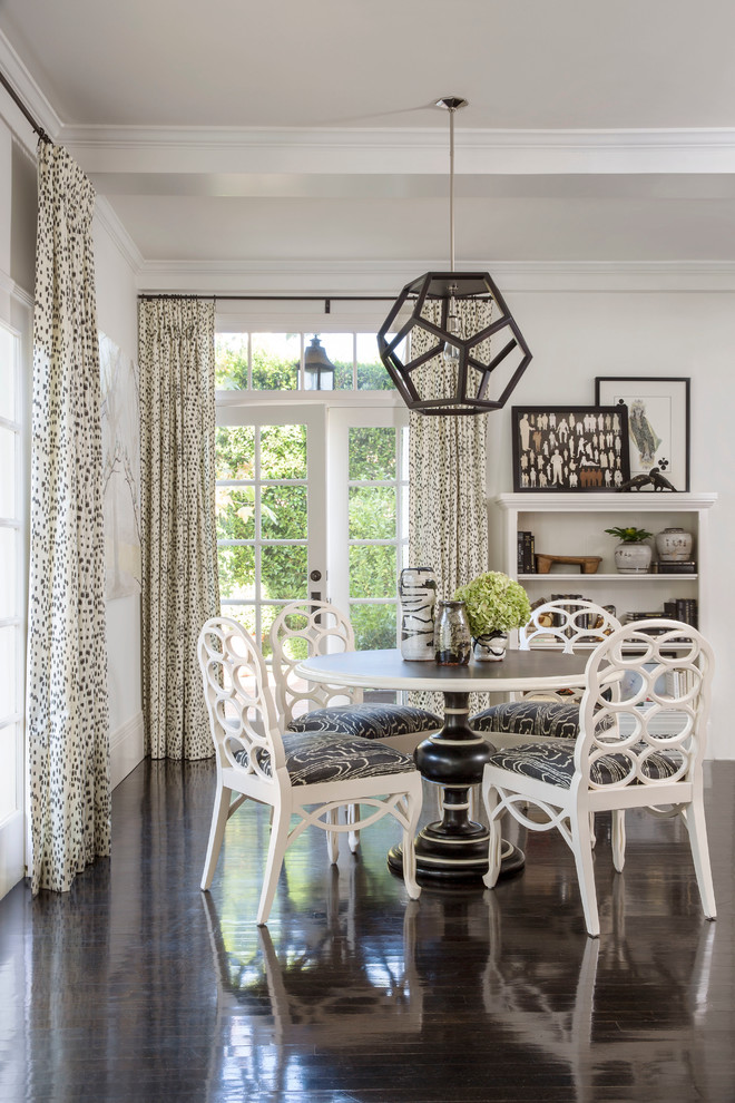 Inspiration for a classic dining room in Los Angeles with white walls and dark hardwood flooring.