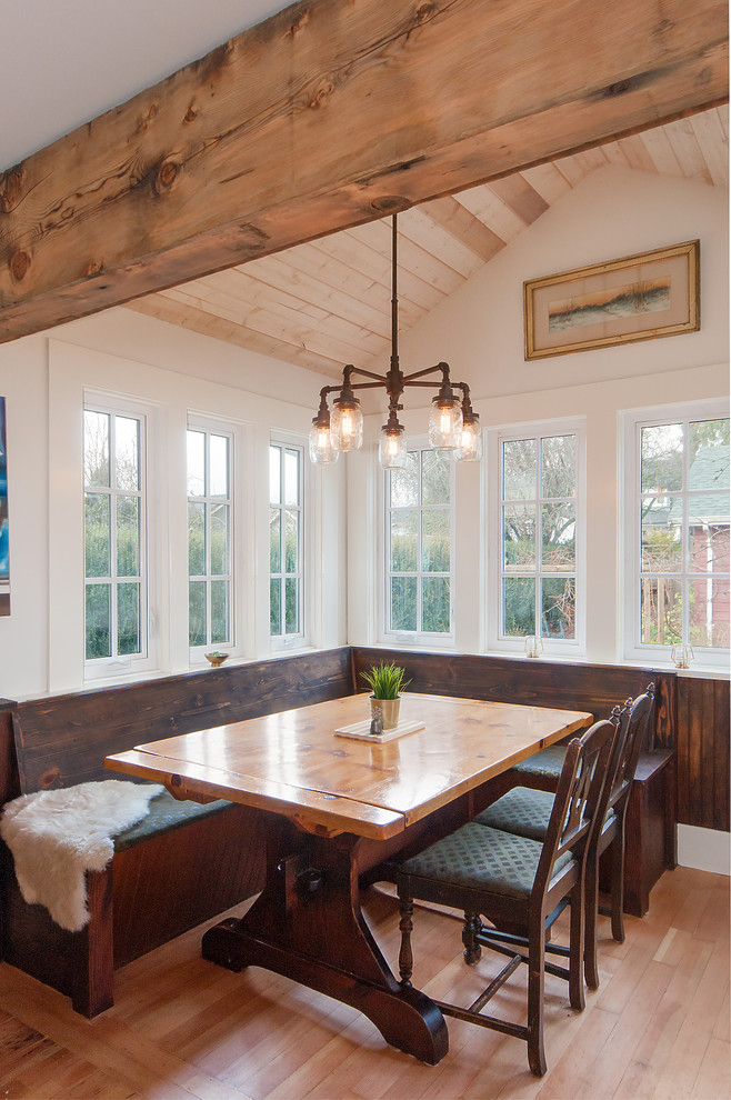 Example of a cottage light wood floor and beige floor dining room design in Vancouver with beige walls