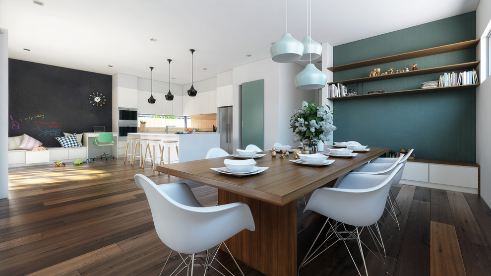 Inspiration pour une salle à manger ouverte sur la cuisine design de taille moyenne avec un mur gris, un sol en bois brun et aucune cheminée.
