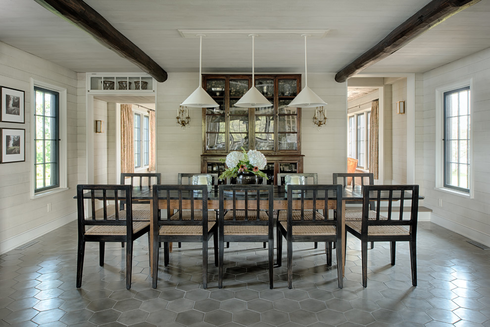 Design ideas for a country enclosed dining room in Minneapolis with white walls.