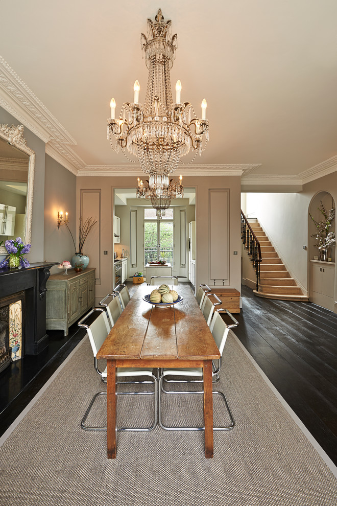 Design ideas for a traditional dining room in London with grey walls and dark hardwood flooring.