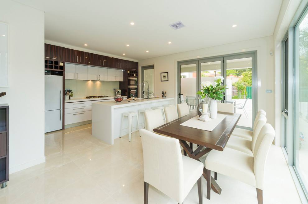 This is an example of a large modern kitchen/dining room in Canberra - Queanbeyan with beige walls and ceramic flooring.