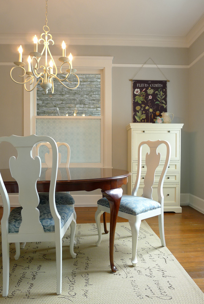 Photo of a traditional dining room in San Francisco with grey walls and medium hardwood flooring.
