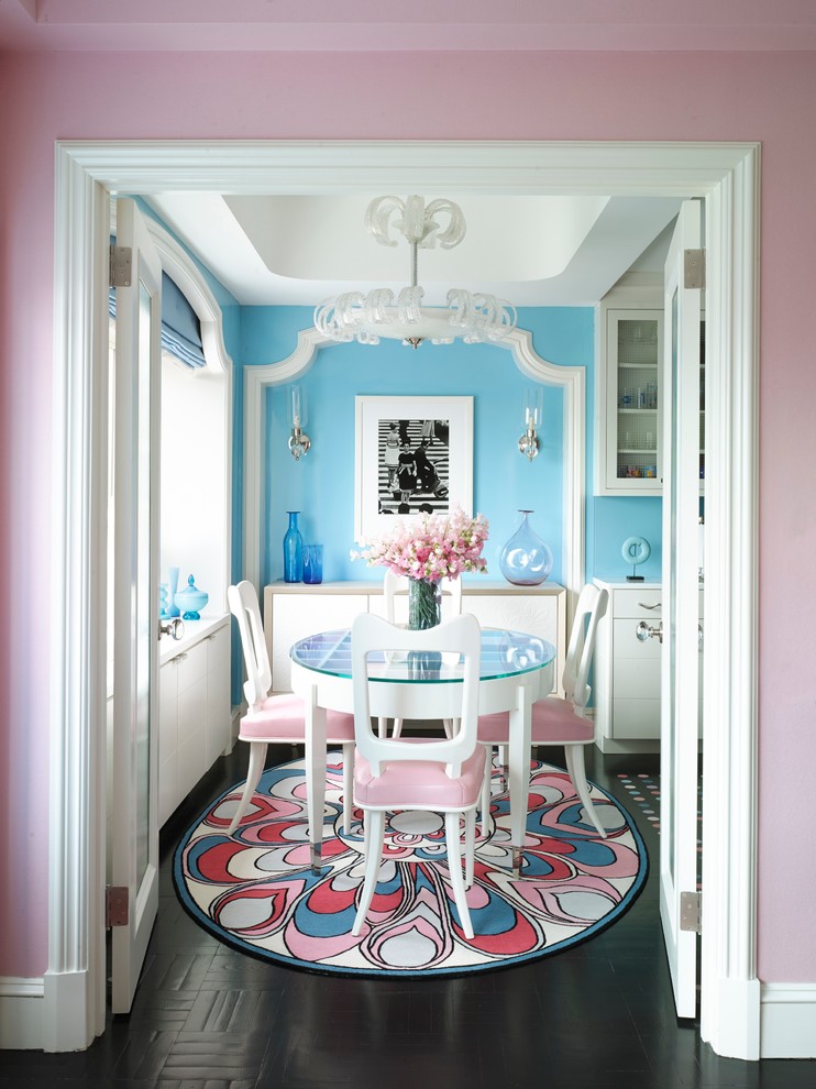 Victorian kitchen/dining room in New York with blue walls and dark hardwood flooring.