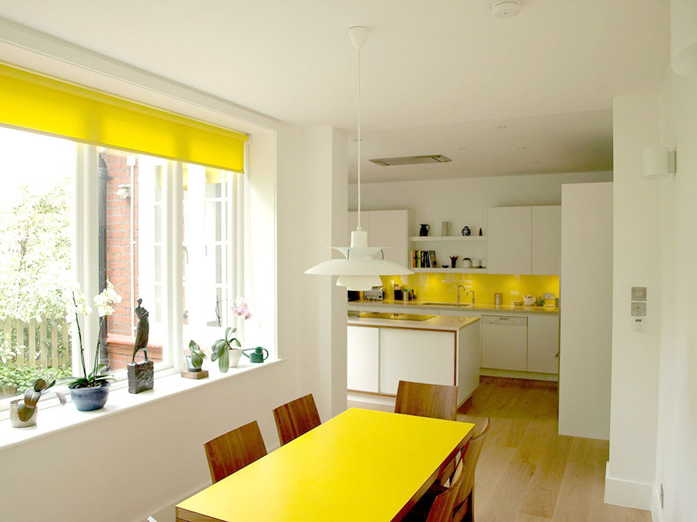 Inspiration for a contemporary kitchen/dining room combo remodel in London