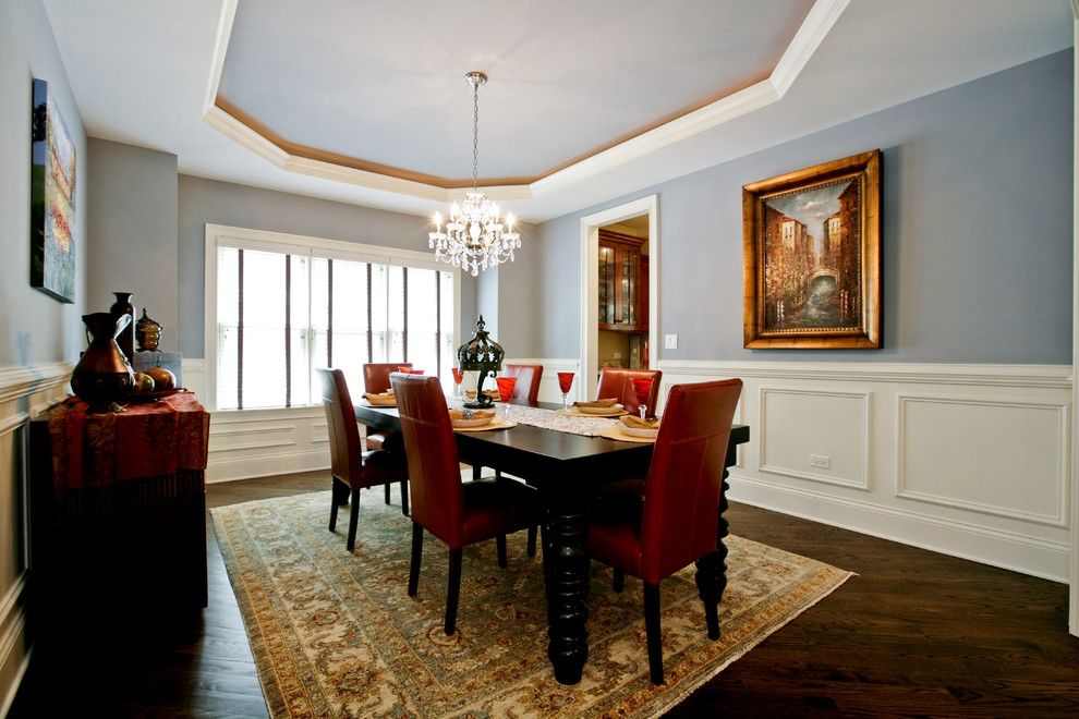 Enclosed dining room - mid-sized traditional dark wood floor and brown floor enclosed dining room idea in Chicago with gray walls and no fireplace