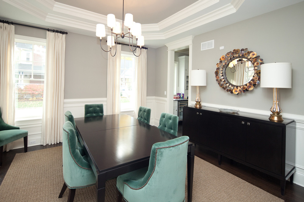 Inspiration for a timeless dark wood floor enclosed dining room remodel in Chicago with gray walls