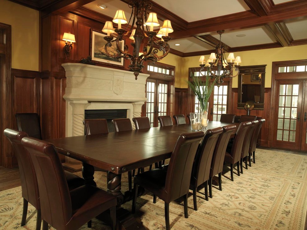 Design ideas for a large classic enclosed dining room in Baltimore with beige walls, dark hardwood flooring, a standard fireplace and a stone fireplace surround.