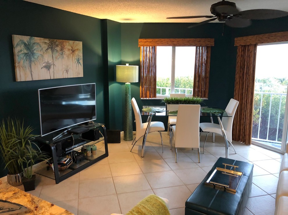 Mid-sized trendy ceramic tile and beige floor great room photo in Miami with blue walls and no fireplace