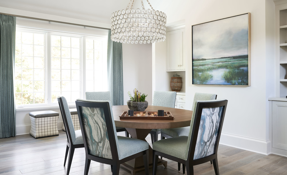 Dining room - transitional medium tone wood floor and gray floor dining room idea in Charlotte with white walls