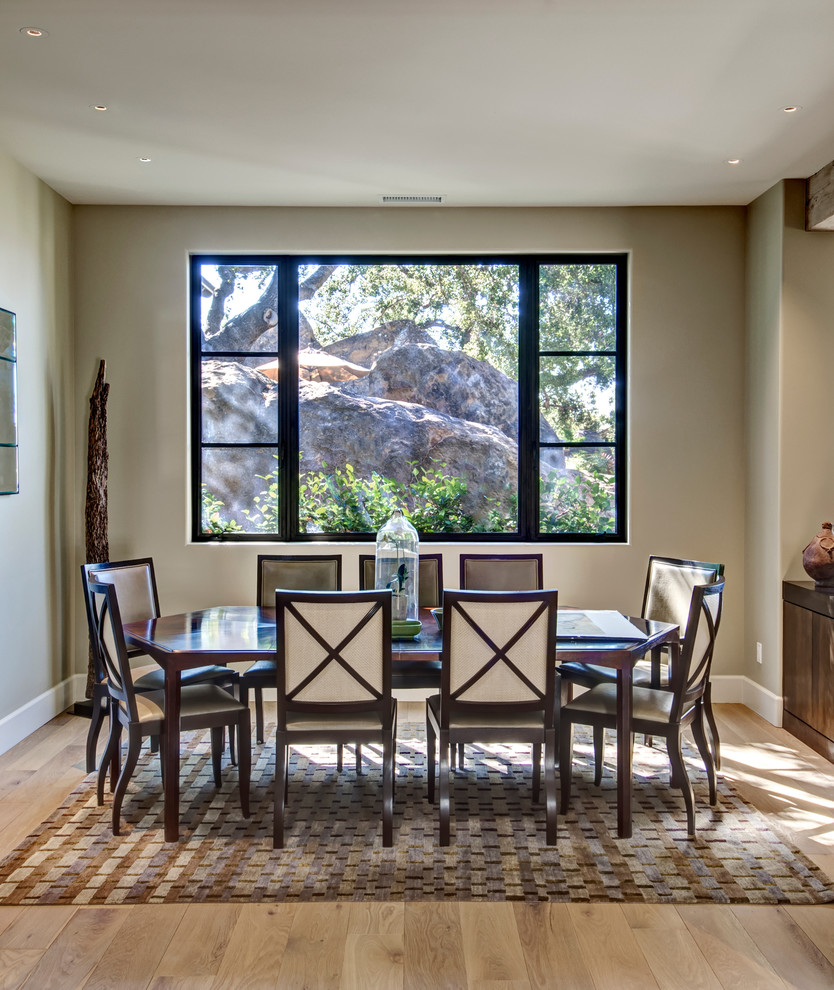 Dining room - mediterranean light wood floor dining room idea in Santa Barbara with beige walls
