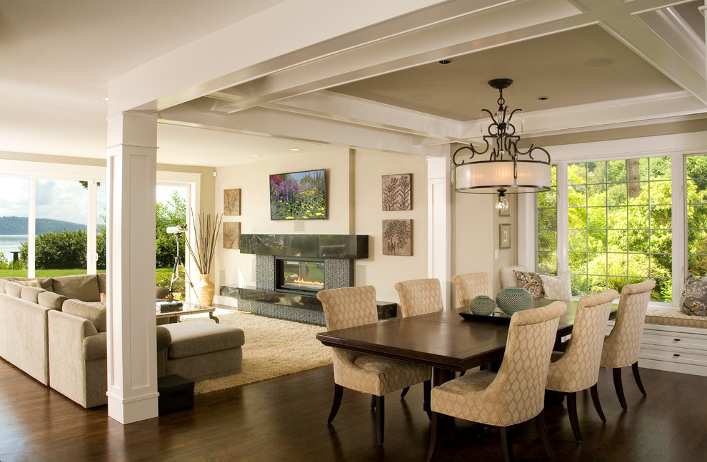 Inspiration for a traditional open plan dining room in Seattle with beige walls and dark hardwood flooring.