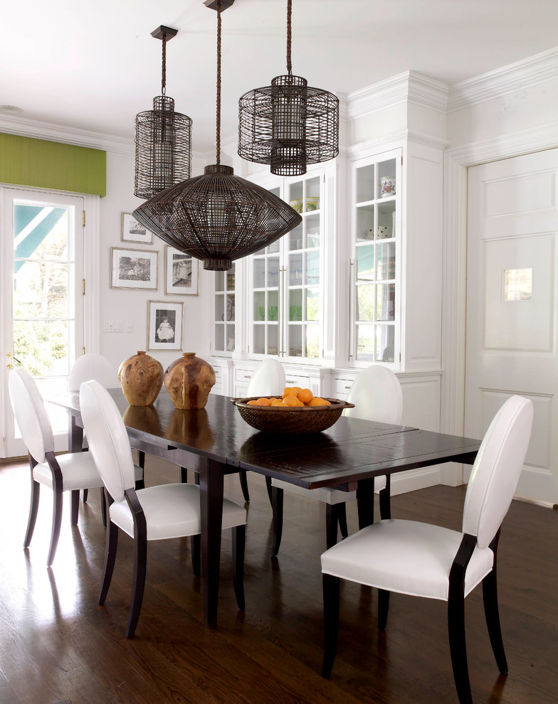 This is an example of a classic kitchen/dining room in New York with white walls.