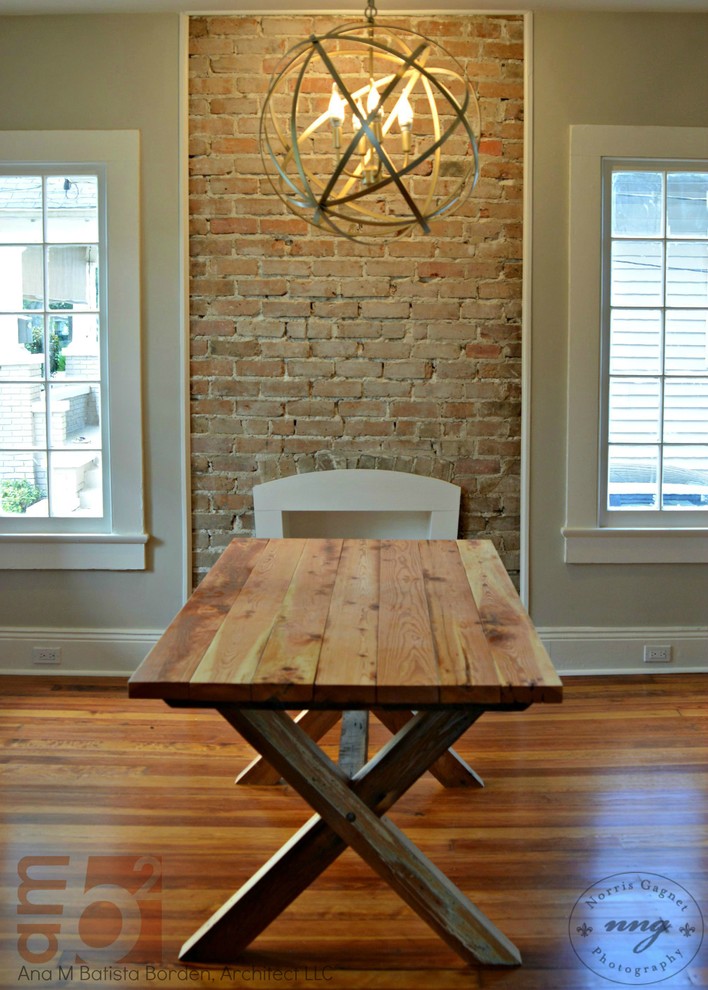 Inspiration for a medium sized rustic open plan dining room in New Orleans with grey walls and a brick fireplace surround.
