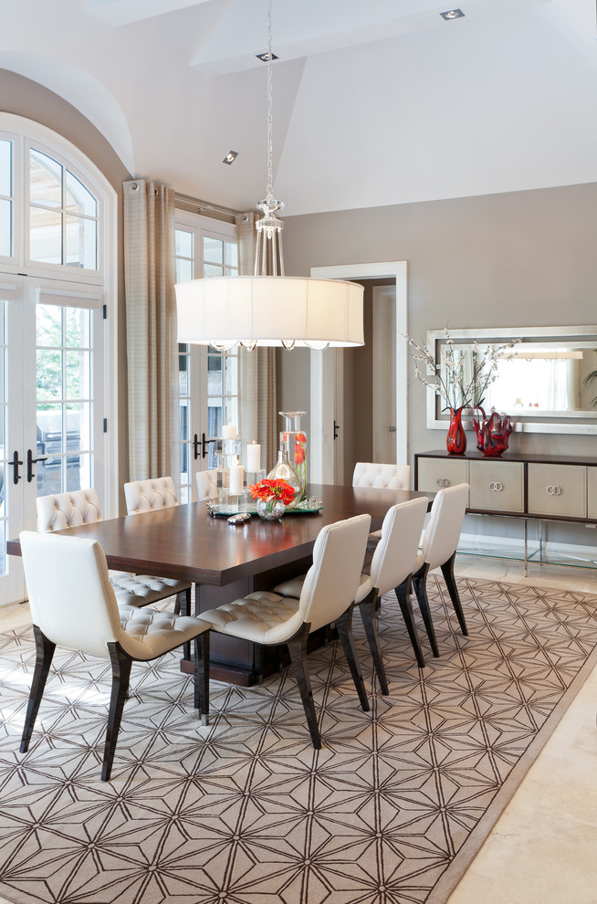 This is an example of a large contemporary open plan dining room in Toronto with beige walls, ceramic flooring and beige floors.