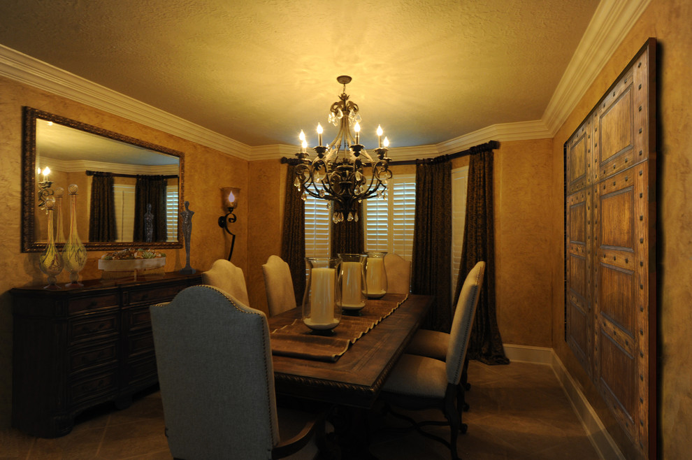 Example of a mid-sized classic limestone floor enclosed dining room design in Houston with beige walls