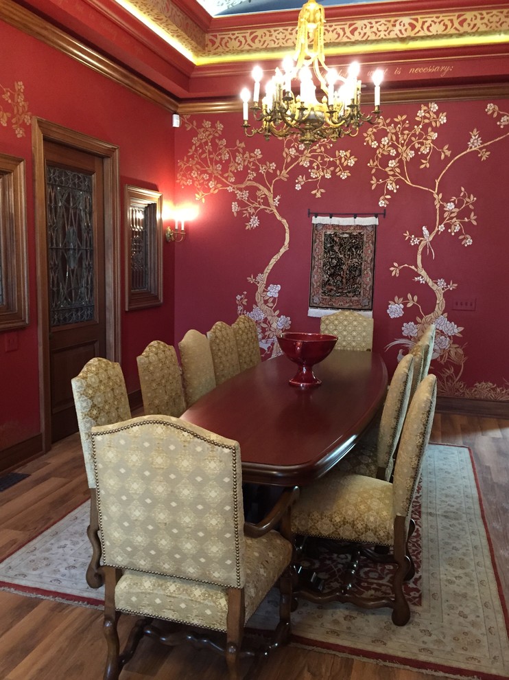 This is an example of a medium sized mediterranean enclosed dining room in San Francisco with red walls and lino flooring.