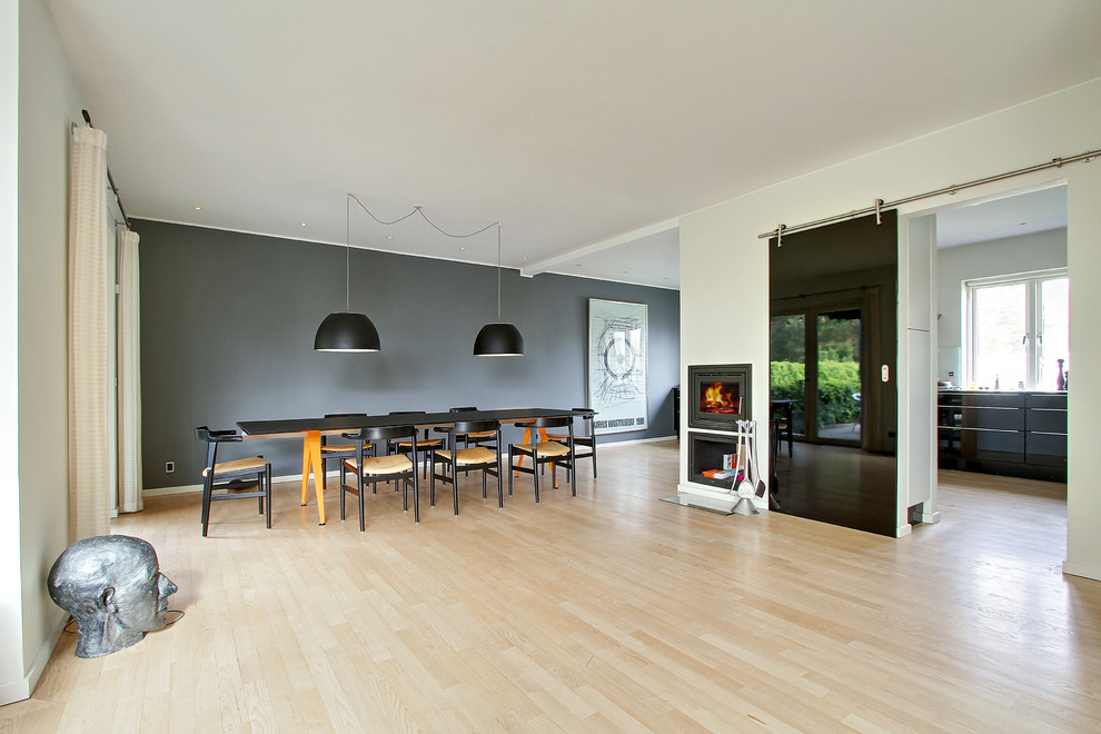 Example of a minimalist dining room design in Wiltshire