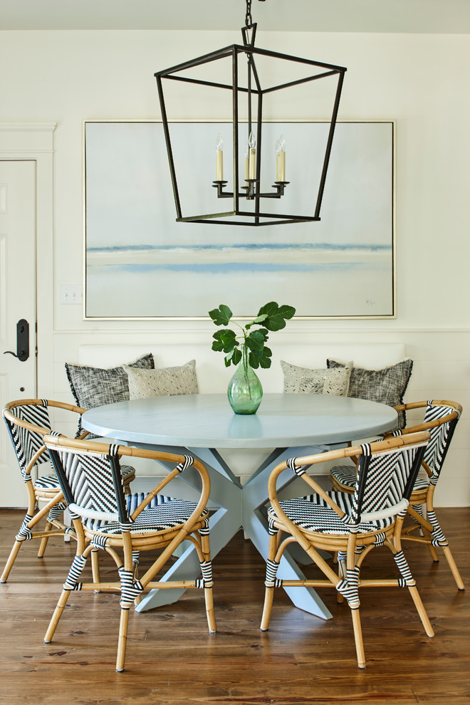 Photo of a nautical dining room in Other with white walls, dark hardwood flooring and brown floors.