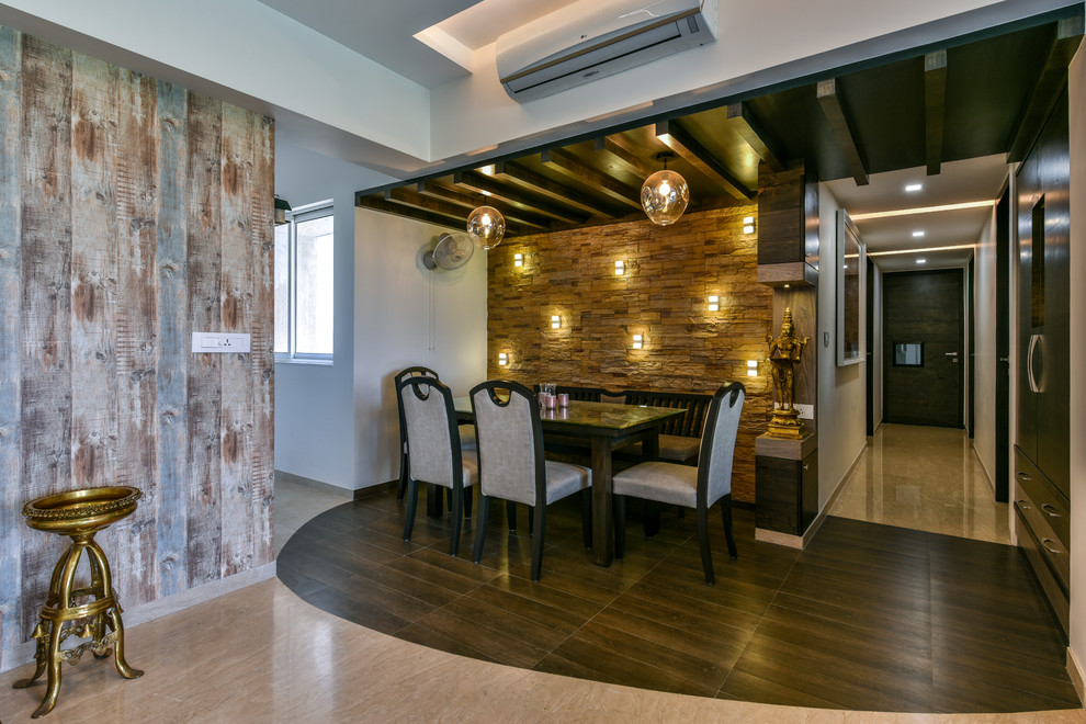 Inspiration for a modern dining room remodel in Mumbai