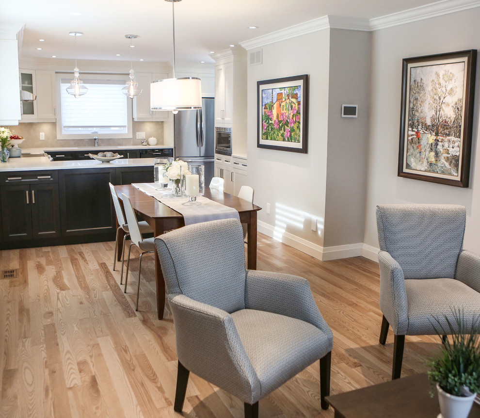 Small traditional kitchen/dining room in Toronto with grey walls and light hardwood flooring.