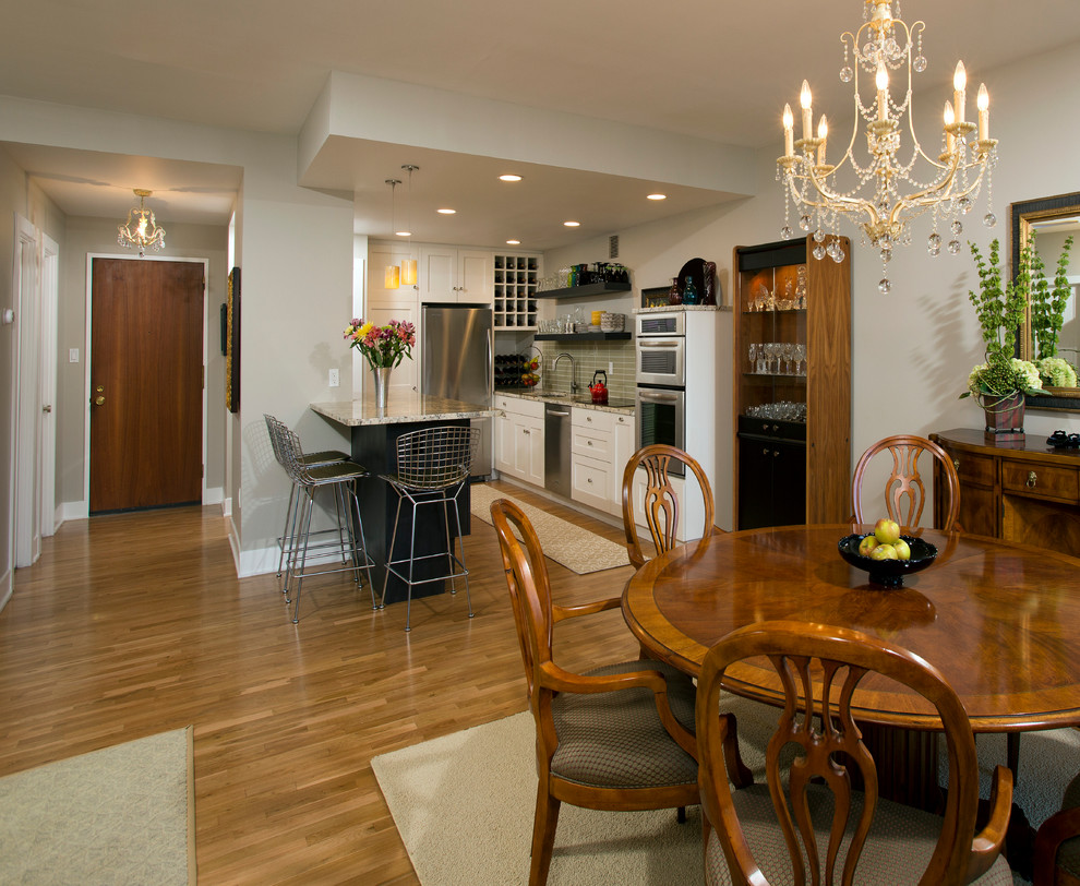 Inspiration for a mid-sized timeless light wood floor great room remodel in DC Metro with no fireplace and gray walls