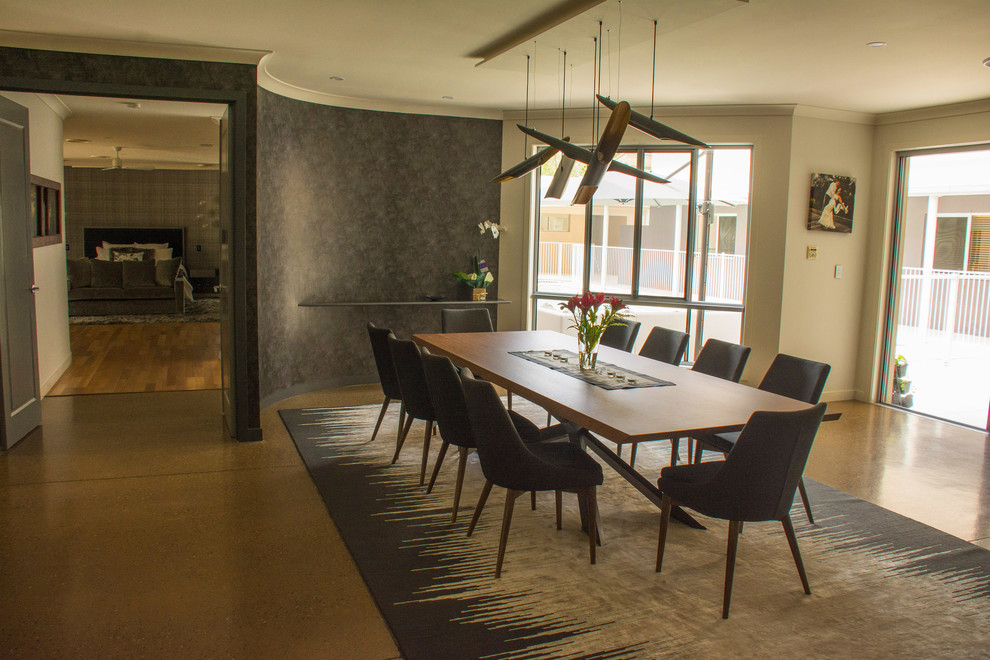 This is an example of a contemporary dining room in Sunshine Coast.