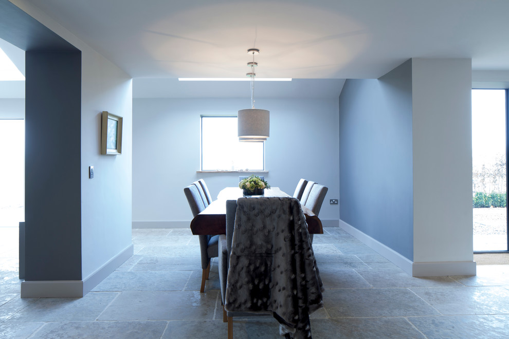 Design ideas for a large contemporary dining room in Cheshire with white walls and limestone flooring.