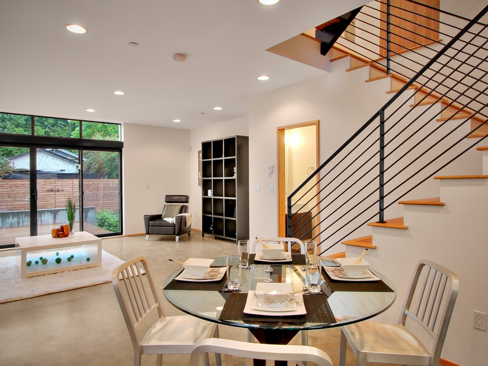 Photo of a contemporary dining room in Seattle with white walls.