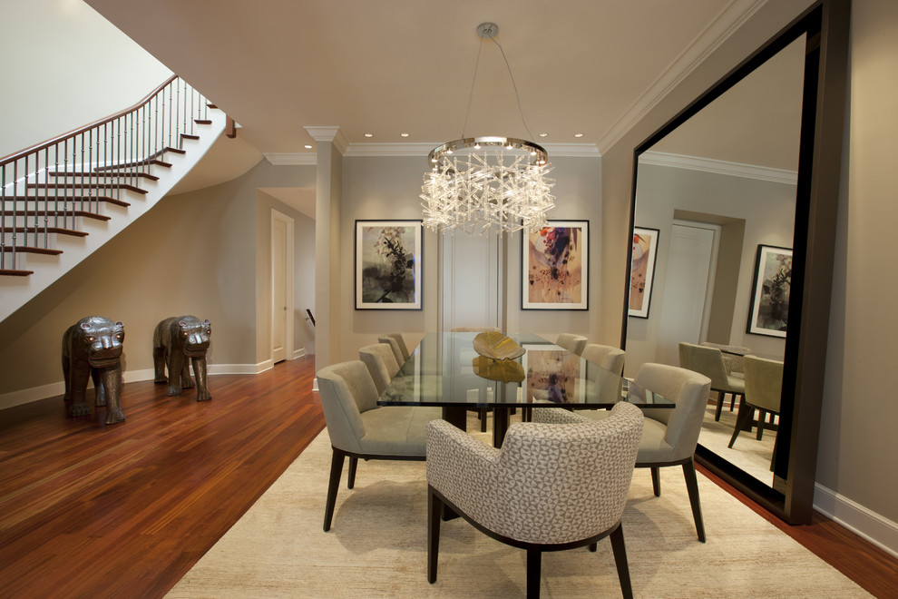 Example of a trendy dark wood floor and brown floor dining room design in Chicago with beige walls