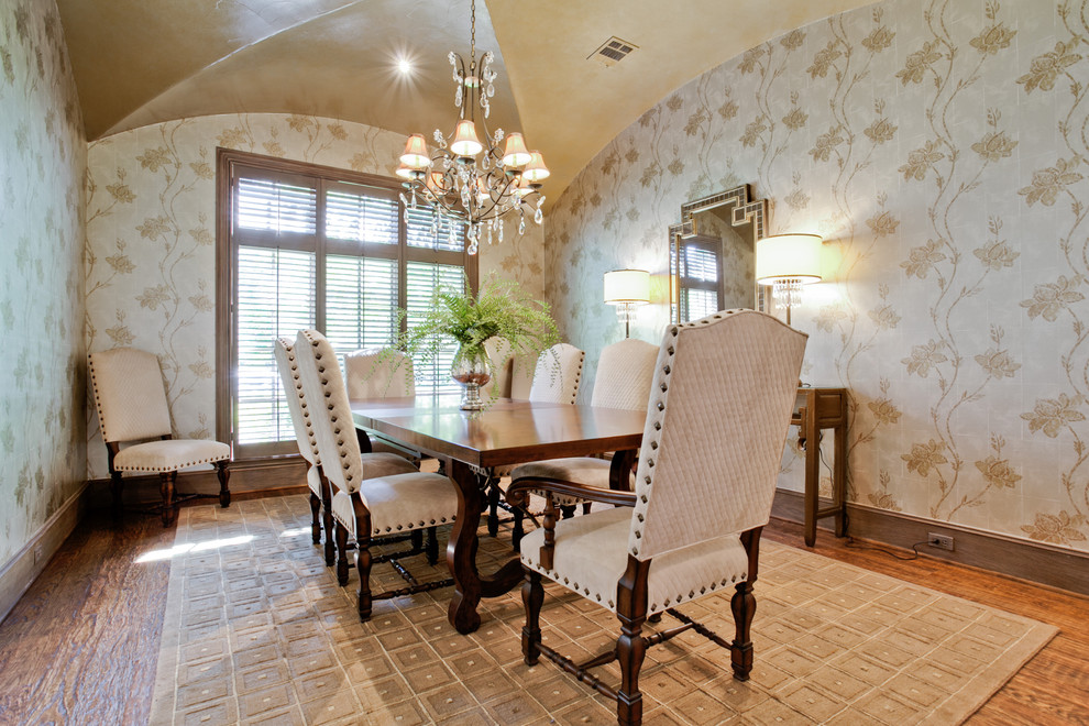 This is an example of a traditional dining room in Dallas with dark hardwood flooring.