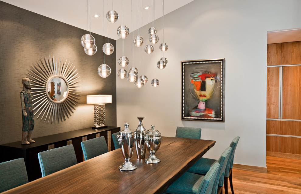 Inspiration for a timeless medium tone wood floor dining room remodel in Minneapolis with gray walls