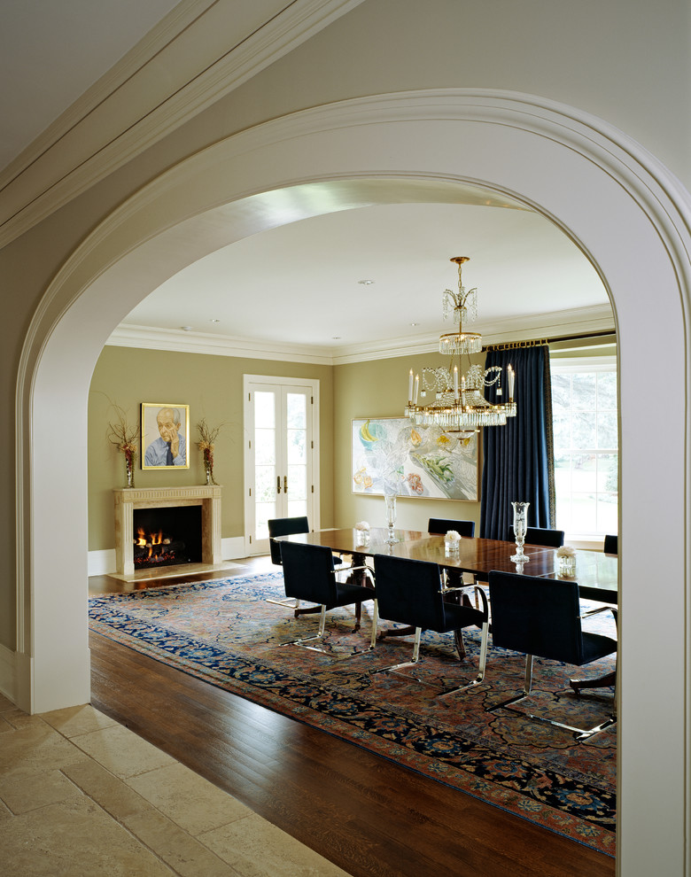 Inspiration for a large classic open plan dining room in Detroit with grey walls, dark hardwood flooring, a standard fireplace, a stone fireplace surround and brown floors.