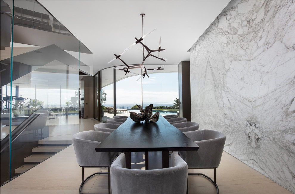 Expansive modern dining room in Los Angeles with white walls, no fireplace and beige floors.