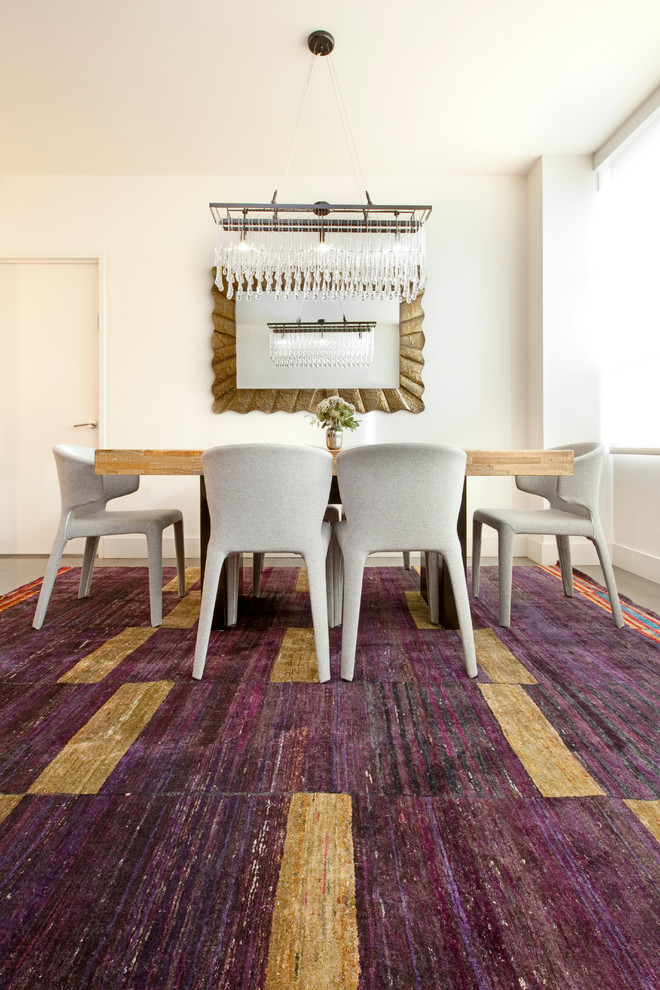 Example of a large trendy carpeted kitchen/dining room combo design in New York with white walls and no fireplace