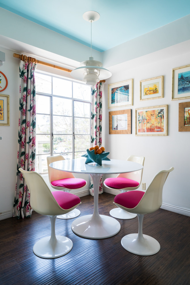 Inspiration for a small bohemian dining room in Los Angeles with vinyl flooring, brown floors, white walls and no fireplace.