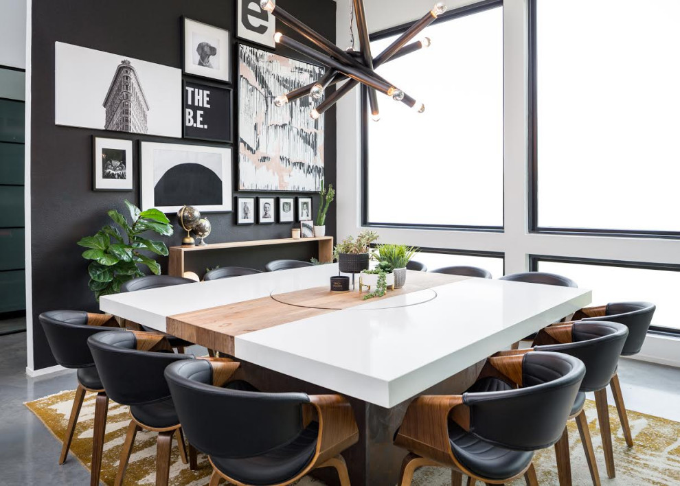 Dining room - contemporary gray floor dining room idea in Austin with black walls