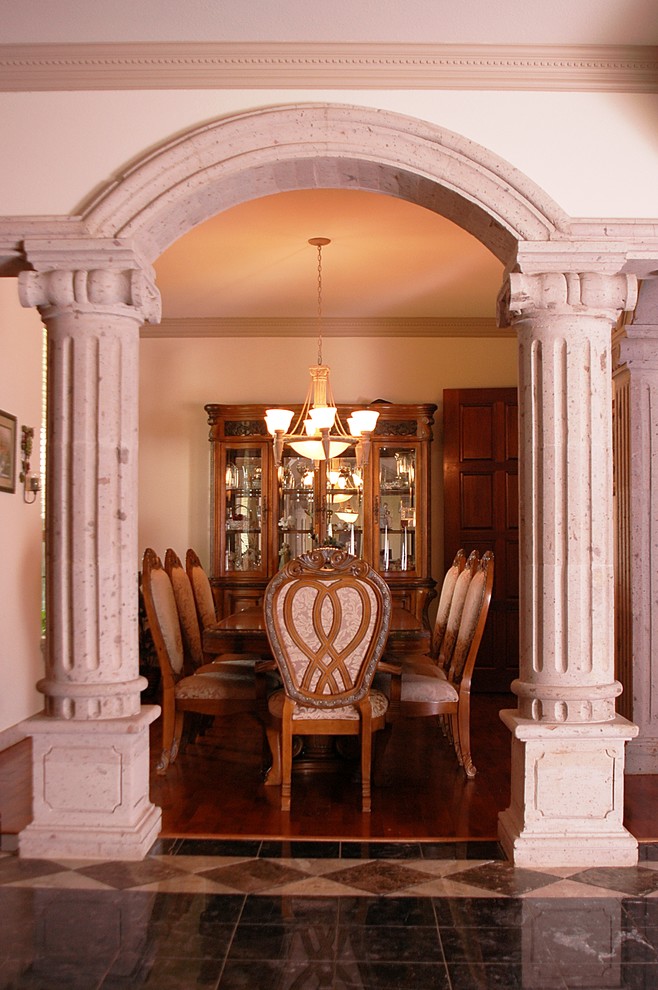 Example of a tuscan dining room design in Dallas