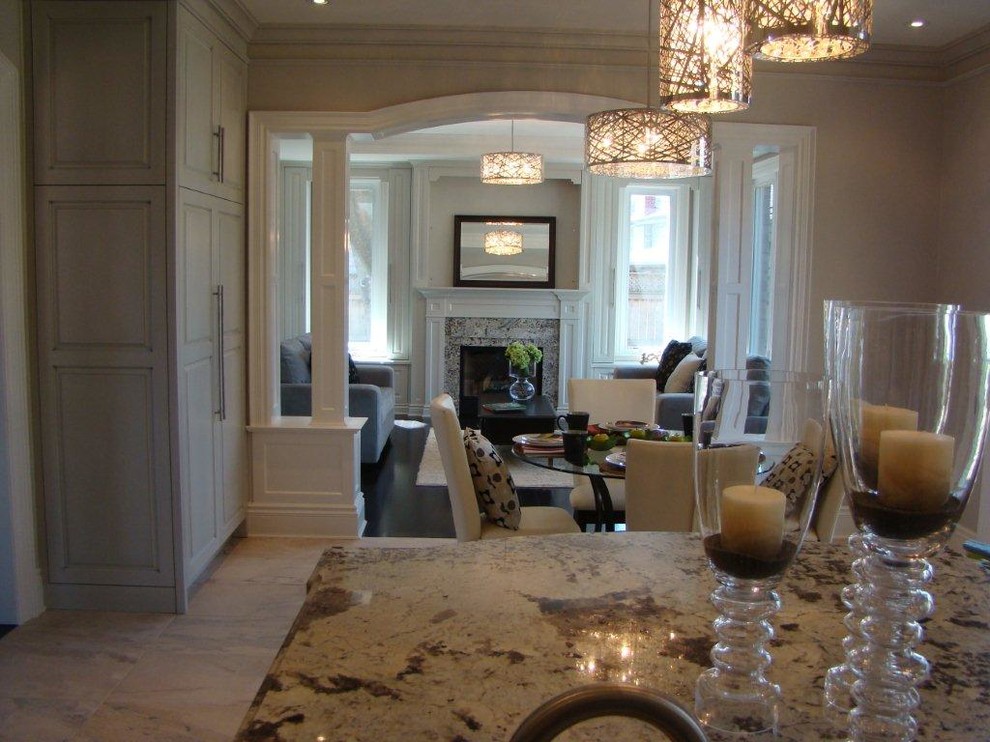 Small transitional marble floor and beige floor kitchen/dining room combo photo in Toronto with beige walls and no fireplace