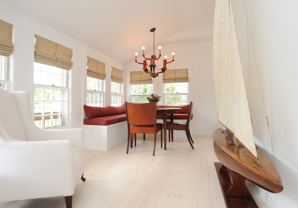 Small arts and crafts light wood floor and beige floor enclosed dining room photo in Boston with white walls