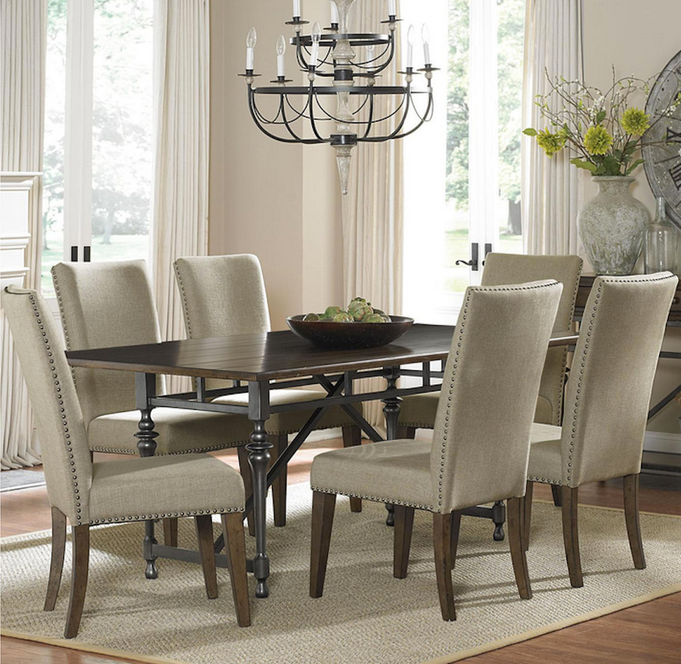 This is an example of a contemporary dining room in Cleveland with beige walls, dark hardwood flooring and no fireplace.