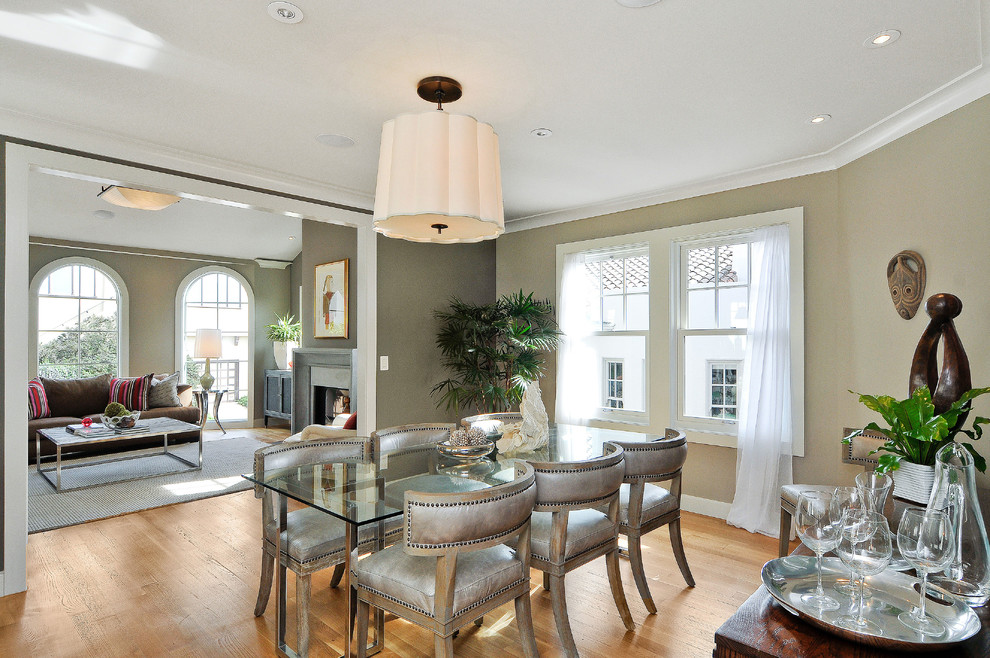 Example of a mid-sized trendy light wood floor kitchen/dining room combo design in San Francisco with beige walls and no fireplace