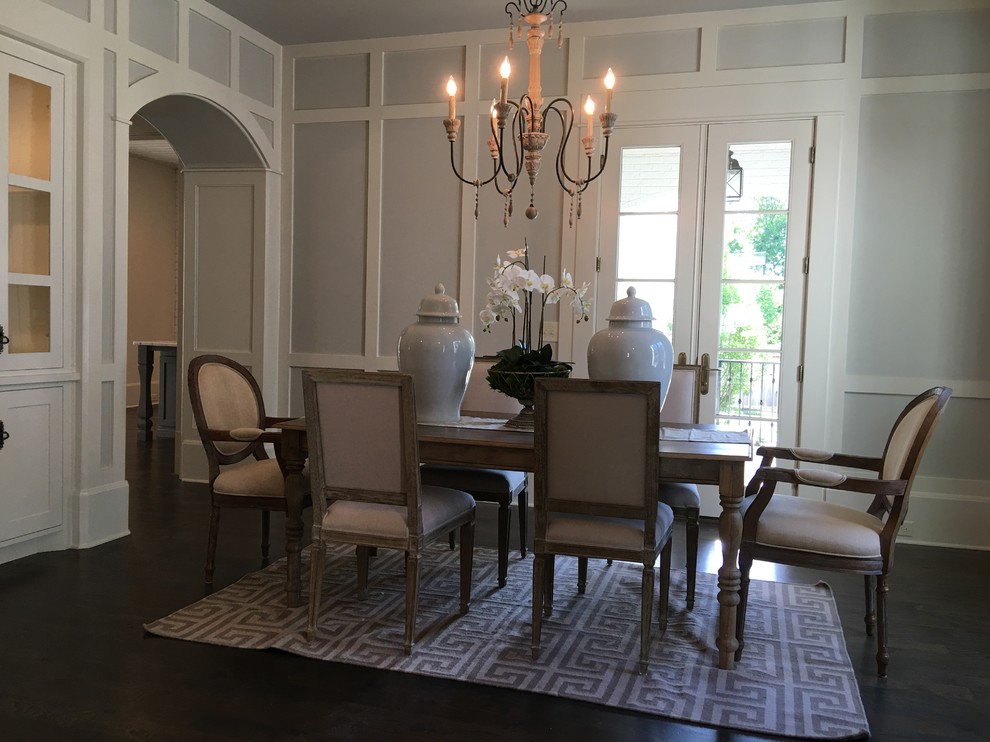 Large classic enclosed dining room in Nashville with beige walls, dark hardwood flooring and no fireplace.