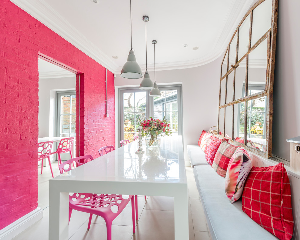 Inspiration for a medium sized bohemian enclosed dining room in Other with white floors and pink walls.