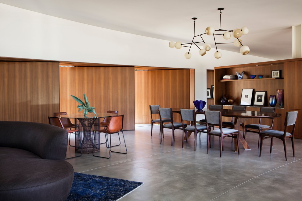 Стильный дизайн: гостиная-столовая в стиле модернизм с бетонным полом - последний тренд