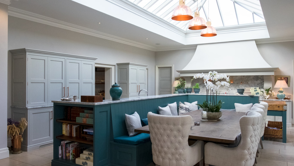 This is an example of a large traditional kitchen/dining room in Hampshire with grey walls and grey floors.